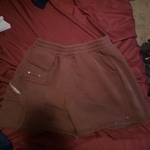 Brown sweatpants material shorts with extra side pockets